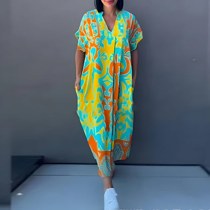 Vestido maxi fluido con estampado vibrante
